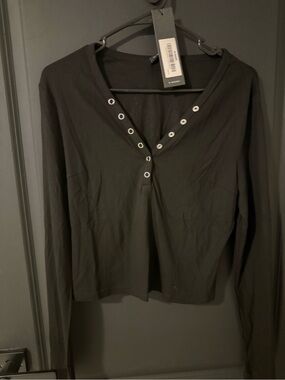 Black Long-Sleeve V-Neck Top with Grommet Accents
